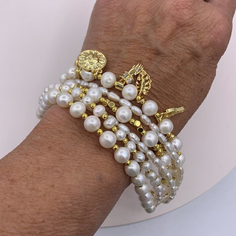 Bracelet, NWOT, 6 strands of real pearls, 18 Karat GP, pave chrystal charms
